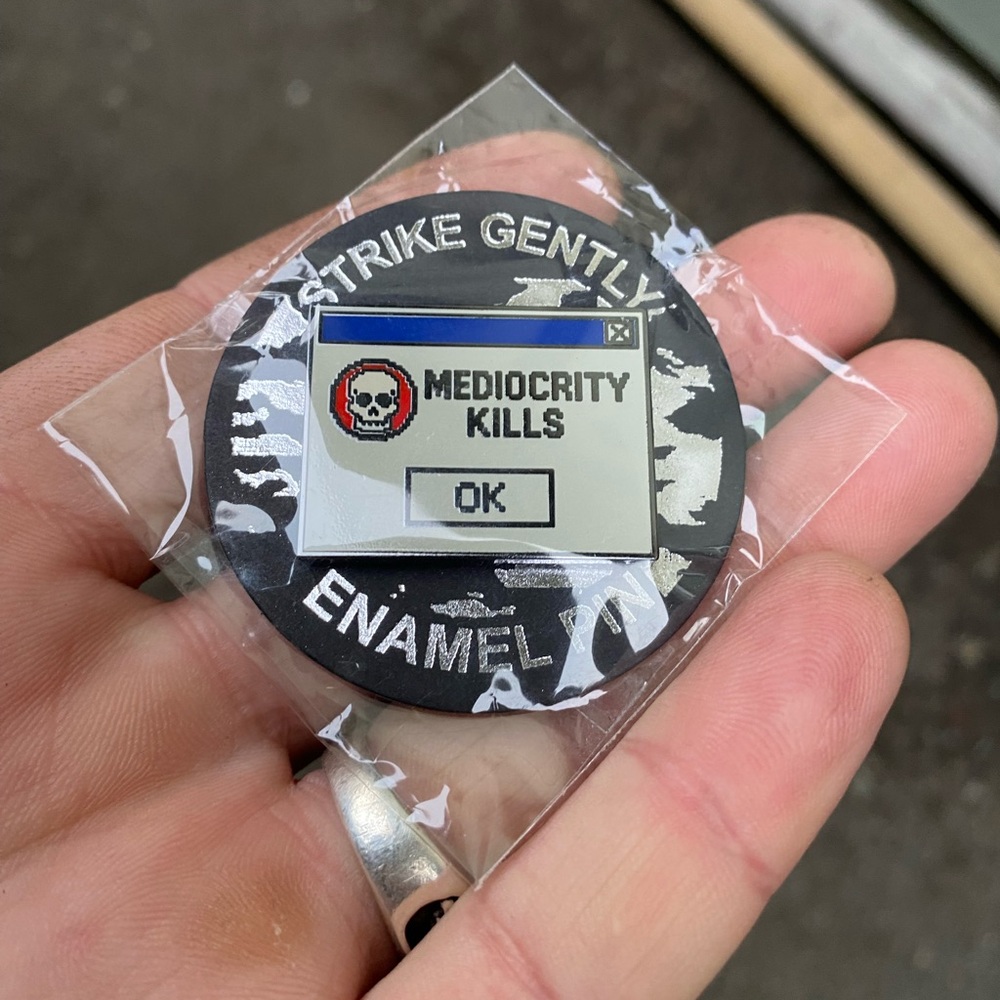 Brand New In Packaging Strike Gently “Mediocrity Kills” Computer Enamel Pin
